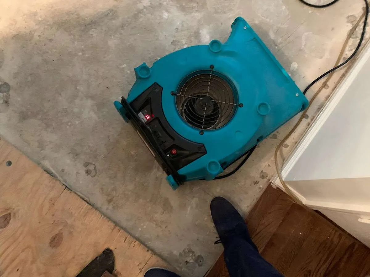 Air mover drying subfloor during Leak Detection & Repair in Dakota Ridge