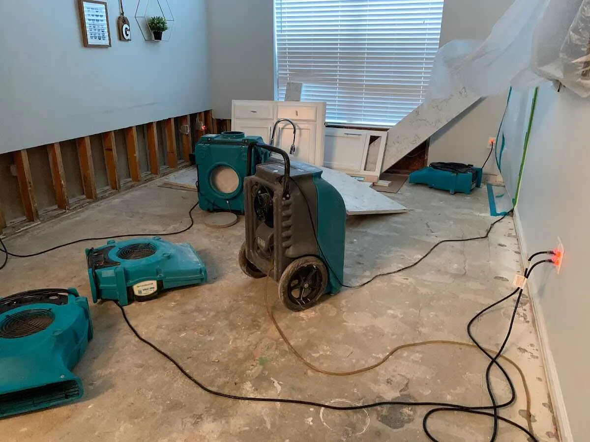 Dehumidifier in flood-cut room for Water Damage Restoration in Dakota Ridge